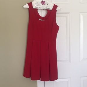 A red skater dress with heart cutouts on the back